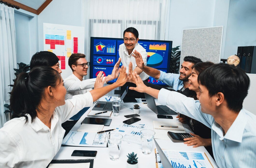 analyst-team-leader-celebrate-with-his-colleague-after-successful-data-analysis-meeting-using-fintech-software-power-with-business-intelligence-bi-dashboard-prudent_31965-271611